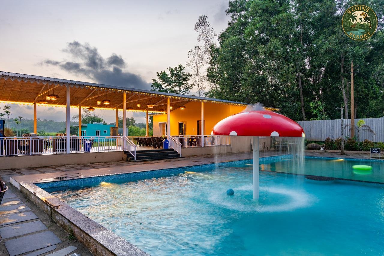 9 Coins Resort pool and dining area in Dandeli